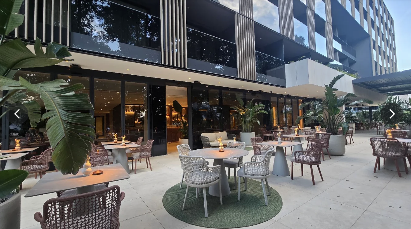Outdoor terrace restaurant at Hotel Sumratin in the evening