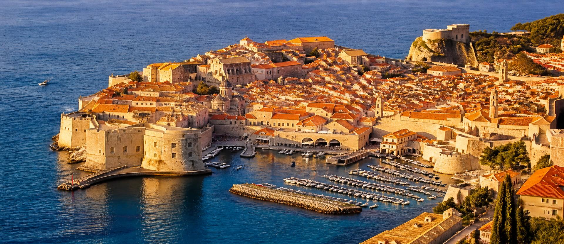 Aerial view of Dubrovnik's old town walls and terracotta roofs beside the Adriatic sea